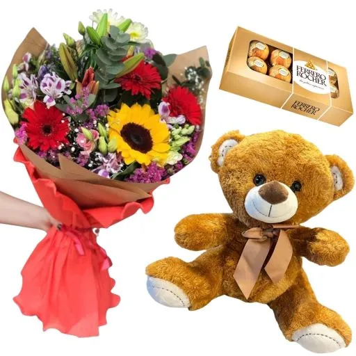 Ramo con flores de estacion con chocolate y peluche 